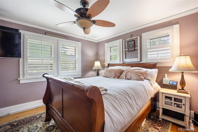 3242 Utica St, Denver, CO 80212 - bedroom featuring wood finished floors, baseboards, crown molding, and a ceiling fan