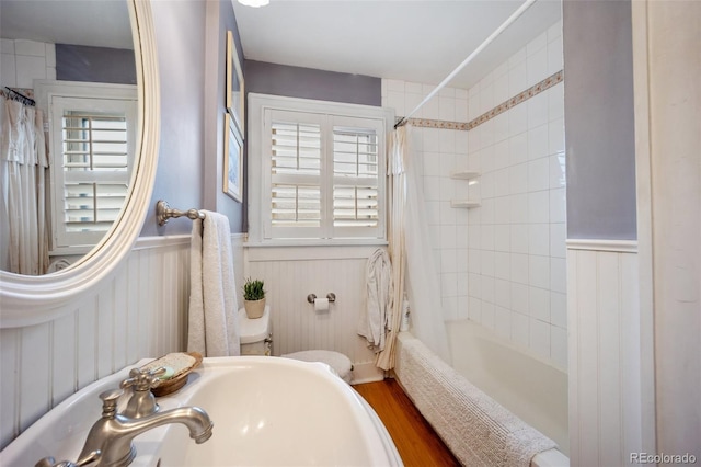 3242 Utica St, Denver, CO 80212 - bathroom with a wainscoted wall, plenty of natural light, shower / bath combo, wood finished floors, and toilet