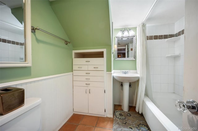 3242 Utica St, Denver, CO 80212 - full bathroom with toilet, shower / tub combo, tile patterned flooring, and wainscoting