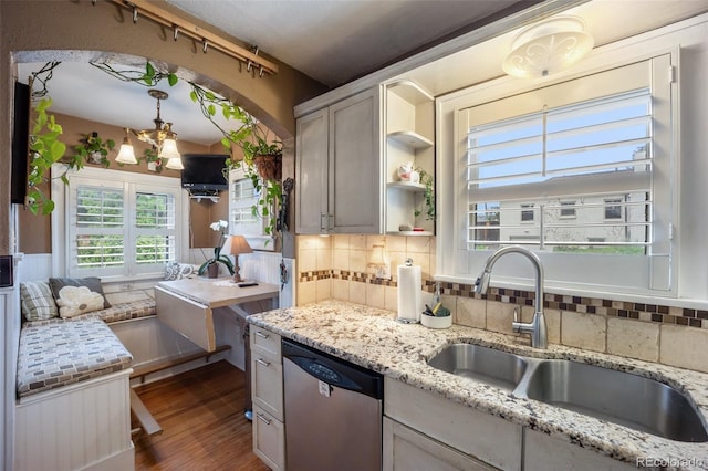 3242 Utica St, Denver, CO 80212 - kitchen with stainless steel dishwasher, a sink, tasteful backsplash, dark wood-type flooring, and open shelves
