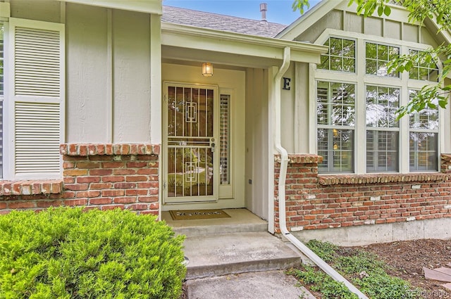 2980 W Long Dr Unit E, Littleton, CO 80120 - entrance to property featuring brick siding and roof with shingles