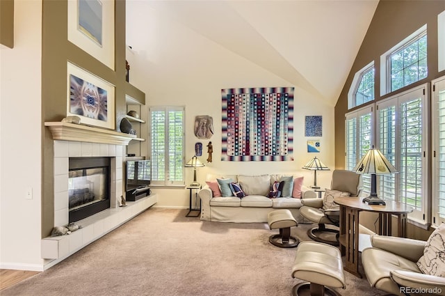 2980 W Long Dr Unit E, Littleton, CO 80120 - living room with baseboards, plenty of natural light, a tile fireplace, carpet floors, and high vaulted ceiling