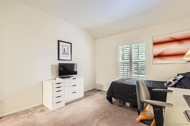 2980 W Long Dr Unit E, Littleton, CO 80120 - bedroom featuring light carpet, vaulted ceiling, and baseboards