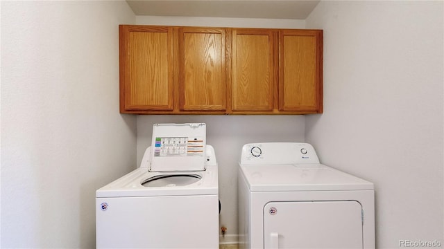 laundry area featuring cabinet space and washer and dryer