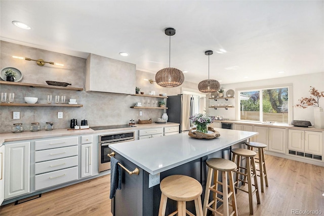 kitchen featuring open shelves, light countertops, and appliances with stainless steel finishes