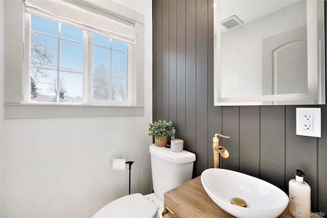 bathroom with toilet and a sink