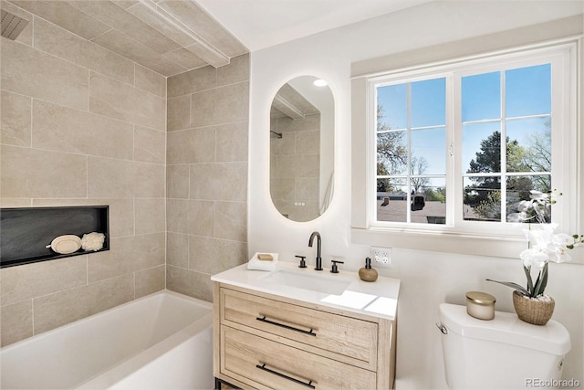 full bath featuring toilet, vanity, and tub / shower combination