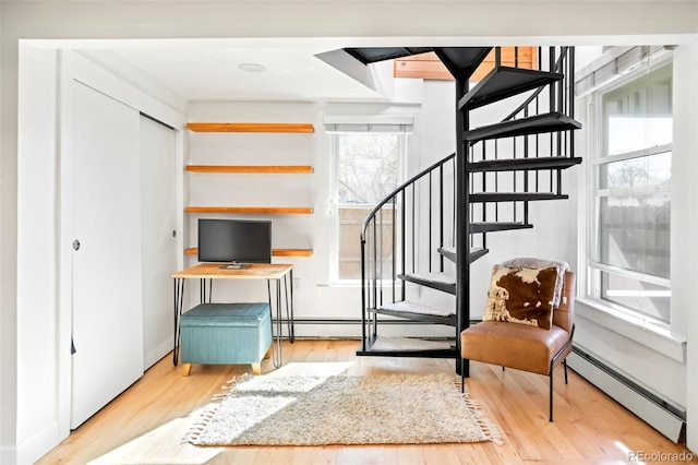 3521 W 40th Ave, Denver, CO 80211 - living area with baseboard heating, wood finished floors, and stairway