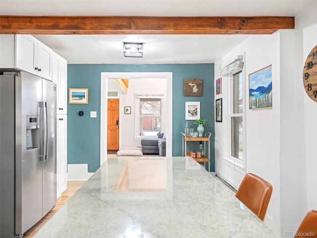 3521 W 40th Ave, Denver, CO 80211 - dining space featuring beam ceiling, light wood-style floors, and baseboard heating