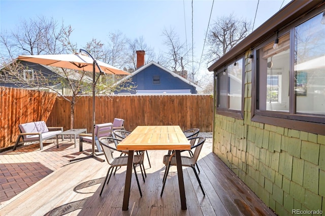 3521 W 40th Ave, Denver, CO 80211 - wooden terrace with outdoor dining space, a fenced backyard, and a patio area