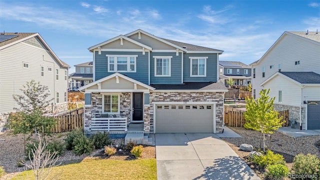 118 N Newcastle Way, Aurora, CO 80018 - view of front of home with an attached garage, covered porch, fence, and concrete driveway