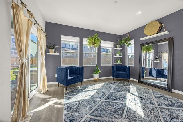 118 N Newcastle Way, Aurora, CO 80018 - living area featuring wood finished floors and baseboards
