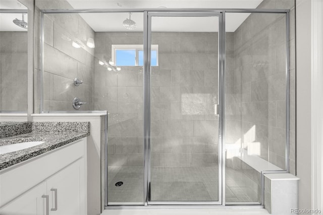 118 N Newcastle Way, Aurora, CO 80018 - bathroom featuring vanity and a stall shower
