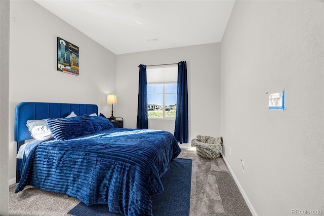 118 N Newcastle Way, Aurora, CO 80018 - bedroom with carpet floors and baseboards