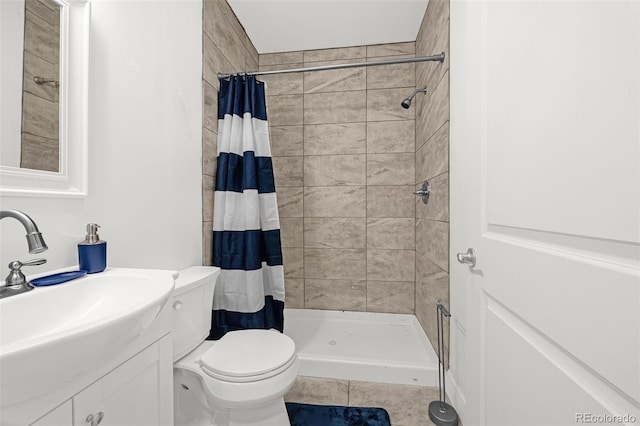 118 N Newcastle Way, Aurora, CO 80018 - full bath featuring a shower stall, tile patterned floors, vanity, and toilet