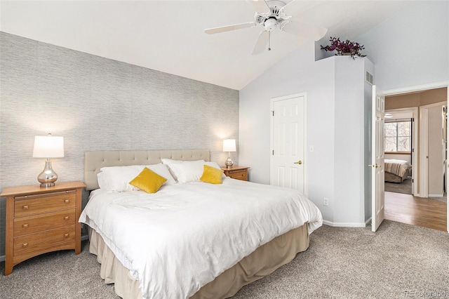 bedroom with ceiling fan, lofted ceiling, and light carpet