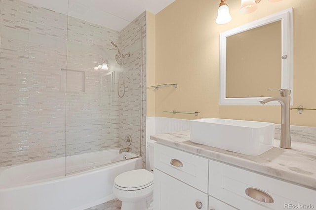 bathroom featuring tub / shower combination, vanity, and toilet