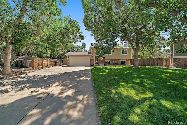 10714 Birch Ct, Thornton, CO 80233 - split level home featuring brick siding, driveway, a garage, and a chimney