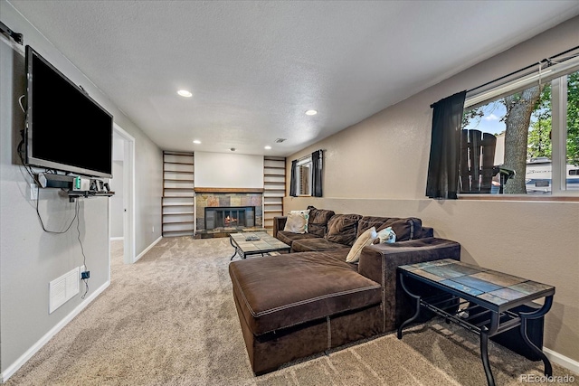 10714 Birch Ct, Thornton, CO 80233 - living room featuring carpet, a tiled fireplace, recessed lighting, and a textured ceiling