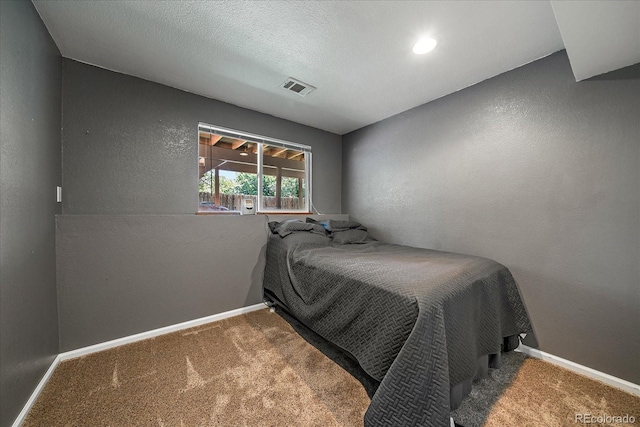 10714 Birch Ct, Thornton, CO 80233 - bedroom with a textured wall and carpet