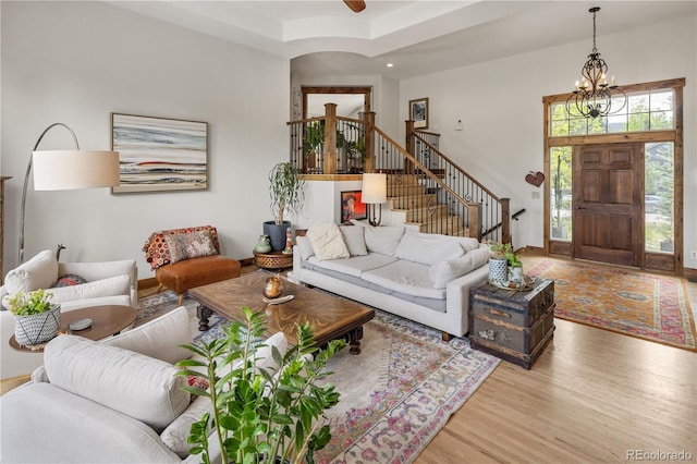 1654 Muirfield Ln, Evergreen, CO 80439 - living area featuring wood finished floors, stairs, a chandelier, baseboards, and recessed lighting