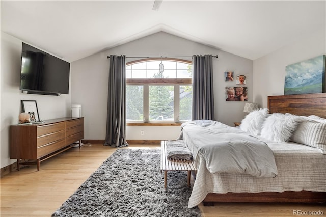 1654 Muirfield Ln, Evergreen, CO 80439 - bedroom with light wood-type flooring, lofted ceiling, and baseboards