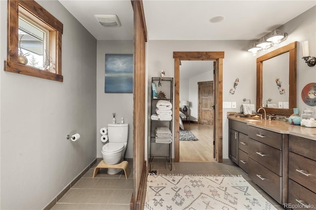 1654 Muirfield Ln, Evergreen, CO 80439 - full bathroom with ensuite bath, vanity, tile patterned floors, toilet, and baseboards