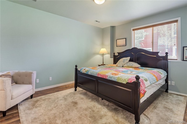 1654 Muirfield Ln, Evergreen, CO 80439 - bedroom featuring wood finished floors and baseboards