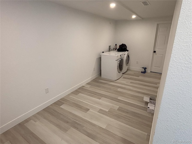 clothes washing area featuring visible vents, recessed lighting, separate washer and dryer, baseboards, and light wood-style floors