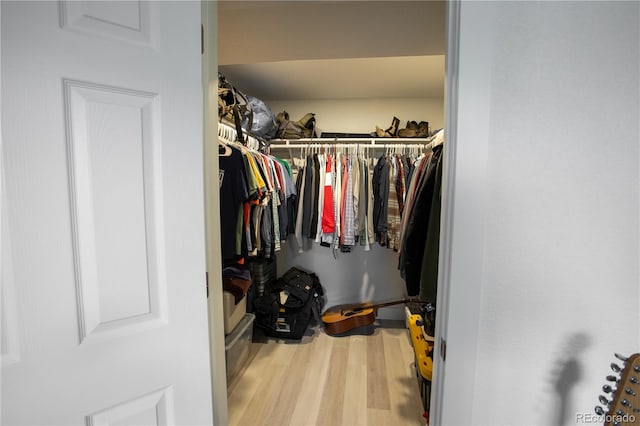 201 Monmouth Ave, Firestone, CO 80520 - walk in closet featuring wood finished floors