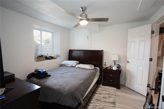 201 Monmouth Ave, Firestone, CO 80520 - bedroom with light wood-style flooring and ceiling fan