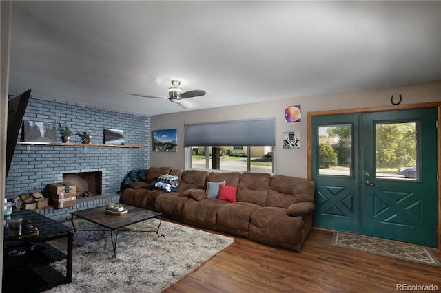 201 Monmouth Ave, Firestone, CO 80520 - living area with a ceiling fan, wood finished floors, and a brick fireplace