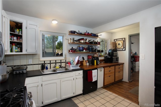 201 Monmouth Ave, Firestone, CO 80520 - kitchen featuring open shelves, dishwashing machine, dark countertops, and a sink
