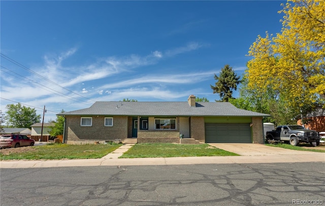 201 Monmouth Ave, Firestone, CO 80520 - single story home with a garage, brick siding, concrete driveway, and a chimney