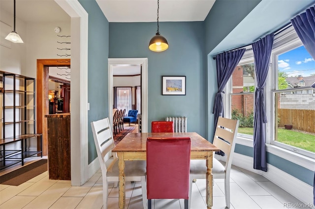 1437 Columbine St, Denver, CO 80206 - dining space with radiator, light tile patterned floors, and baseboards
