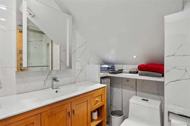 1437 Columbine St, Denver, CO 80206 - bathroom featuring vanity, toilet, and tile walls