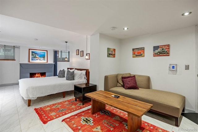 1437 Columbine St, Denver, CO 80206 - bedroom featuring recessed lighting, a lit fireplace, and baseboards