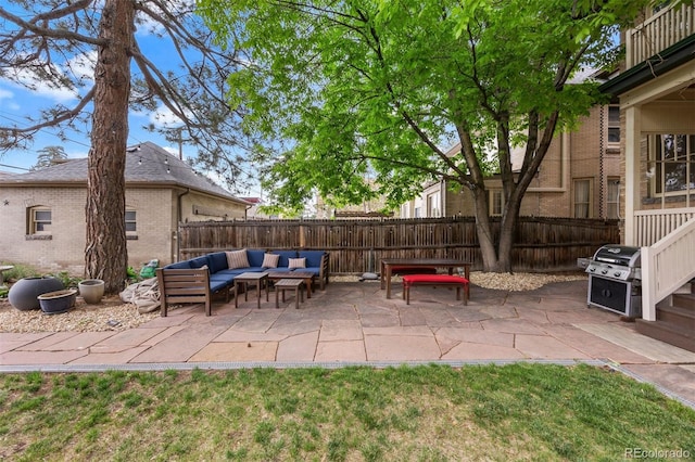1437 Columbine St, Denver, CO 80206 - fenced backyard with an outdoor hangout area, a patio area, and a grill