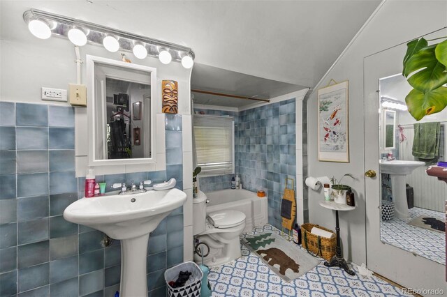 1437 Columbine St, Denver, CO 80206 - full bathroom featuring tile walls, a bath, and toilet