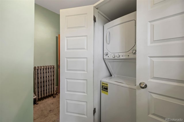 1437 Columbine St, Denver, CO 80206 - laundry room with radiator heating unit, stacked washer / drying machine, and light colored carpet