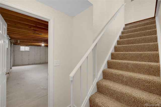 stairway with concrete floors