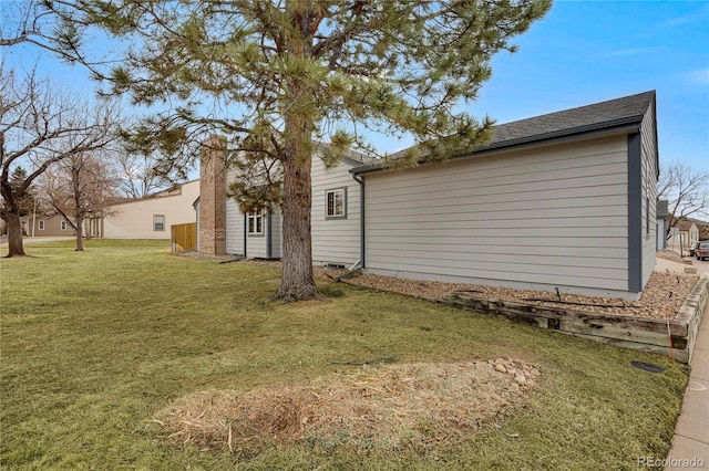 back of house featuring a yard