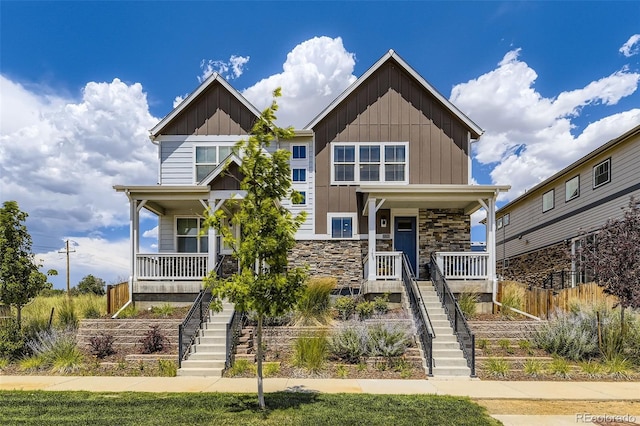 21751 E 7th, Aurora, CO 80018 - craftsman-style home with covered porch, stairs, and board and batten siding