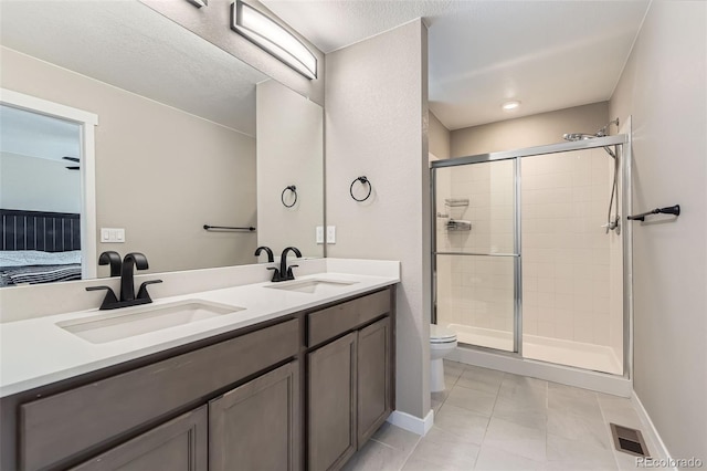 21751 E 7th, Aurora, CO 80018 - ensuite bathroom featuring a stall shower and double vanity