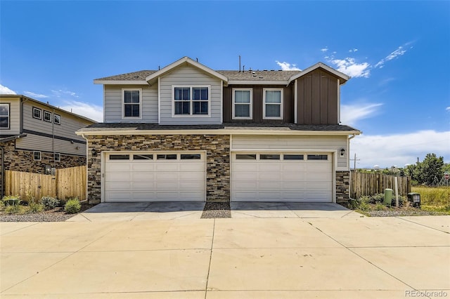 21751 E 7th, Aurora, CO 80018 - view of front of house with an attached garage, stone siding, driveway, and board and batten siding