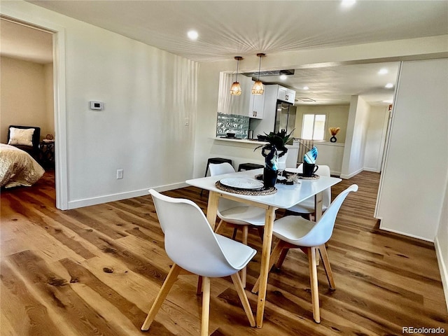 601 W Layton Ave, Englewood, CO 80110 - dining space with wood finished floors and recessed lighting