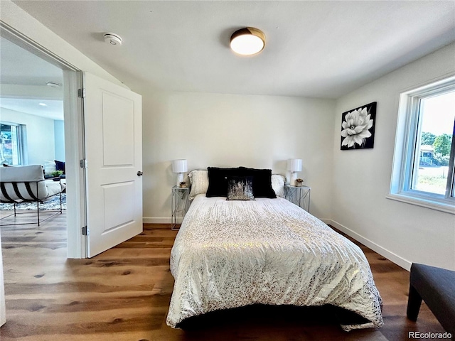 601 W Layton Ave, Englewood, CO 80110 - bedroom featuring multiple windows and wood finished floors