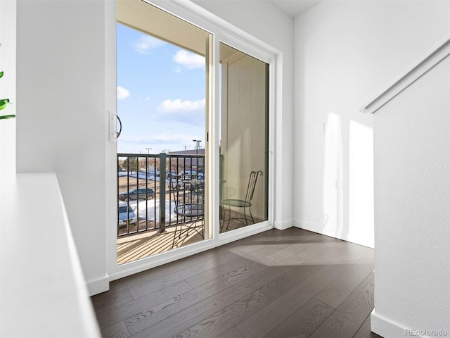 unfurnished room featuring dark wood-type flooring