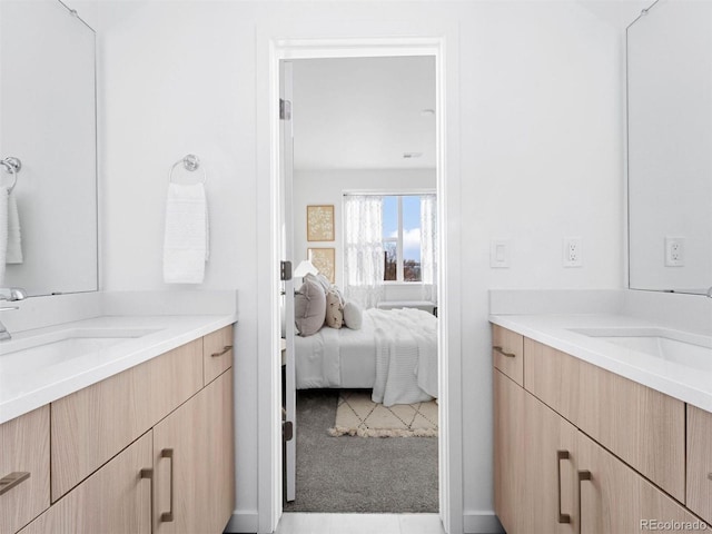 bathroom with tile floors and vanity