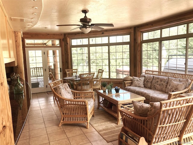 sunroom / solarium with french doors and ceiling fan